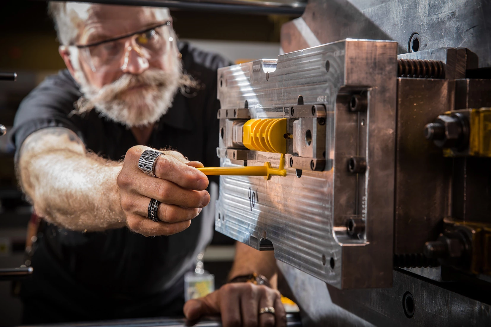 One of the skilled operatives on the injection moulding line