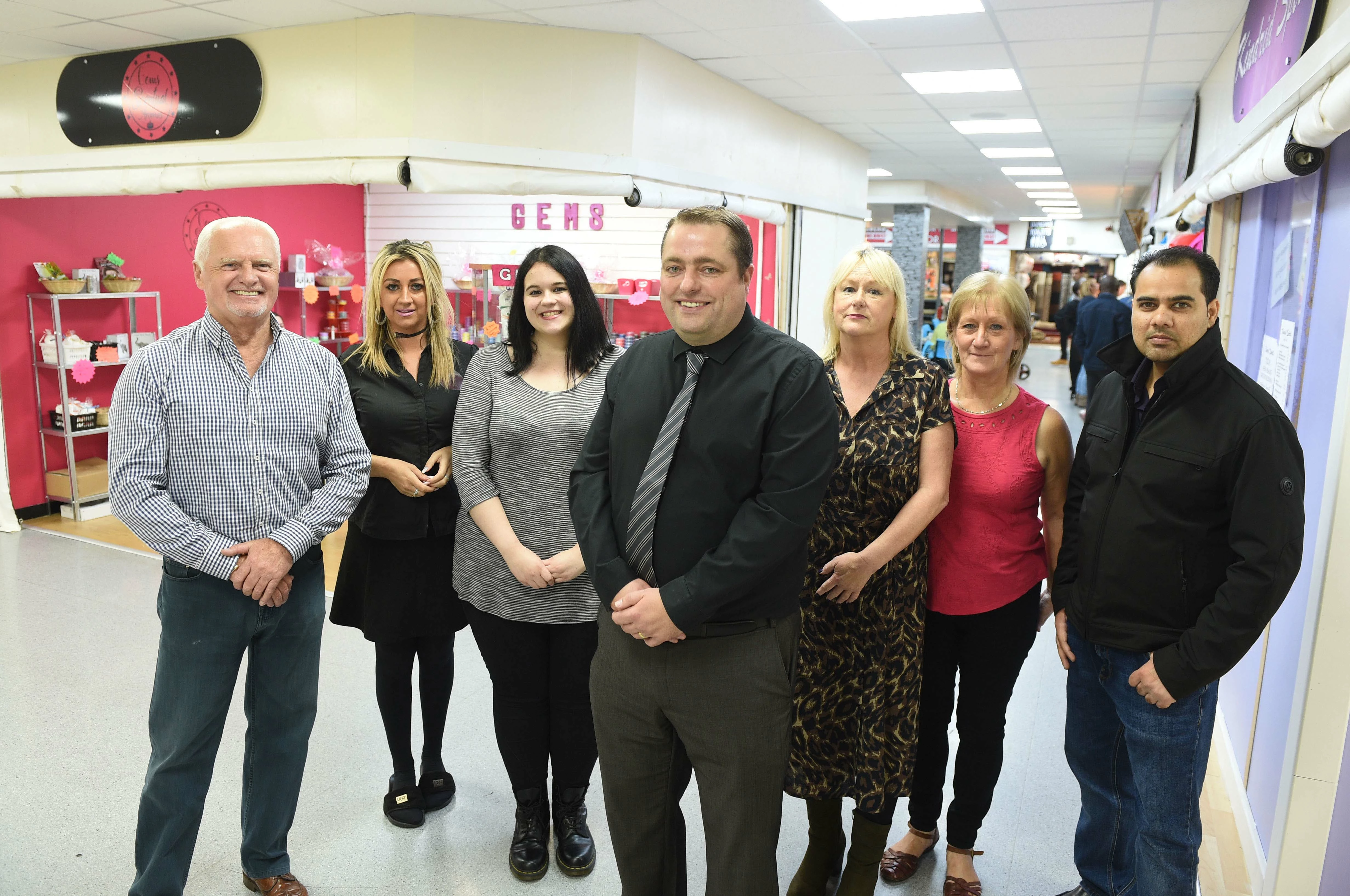 Manager David Harris (centre) with business owners at the market