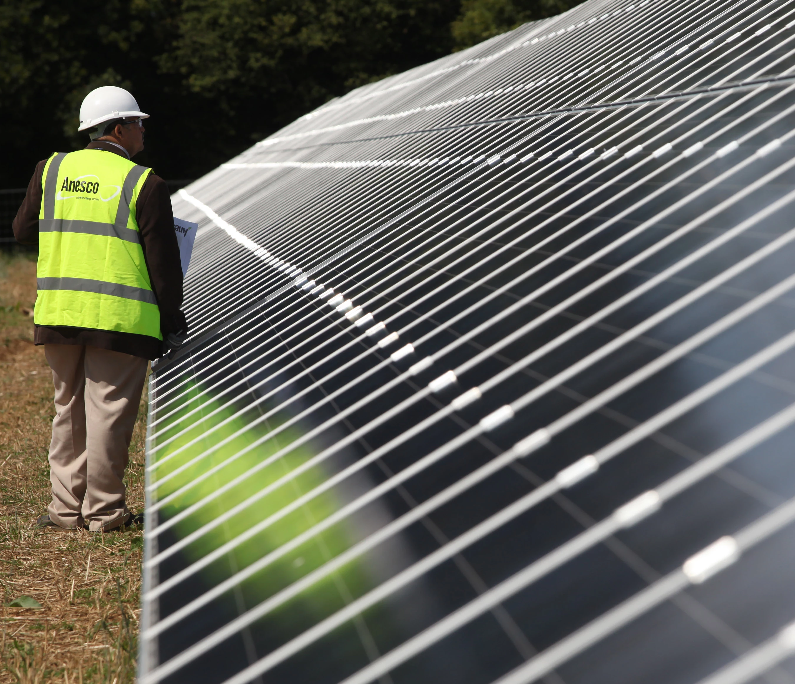 Anesco engineer at a solar farm