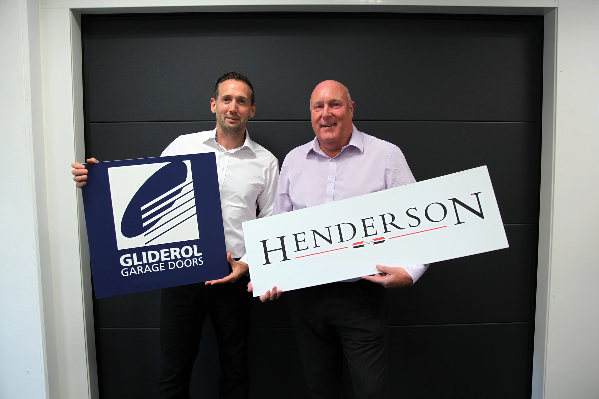 Roy Sinclair, Managing Director at Gliderol Garage Doors (left) and Trevor Cossins, Managing Director at P C Henderson, (right)