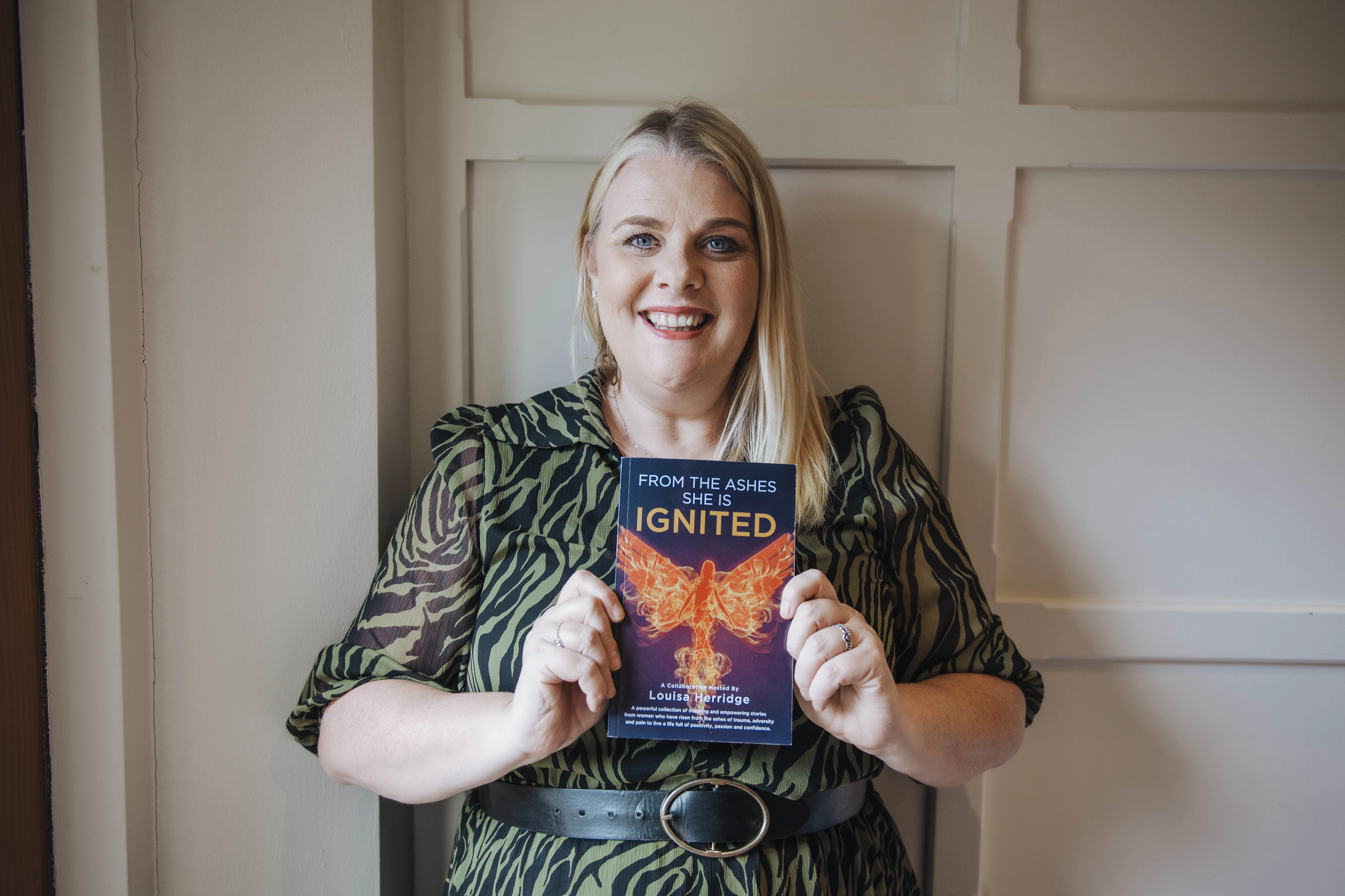 Louisa Herridge holding book that knocked 'ice man' Wim Hof off the book chart top spot! Image by Jennifer Hilton Photography 