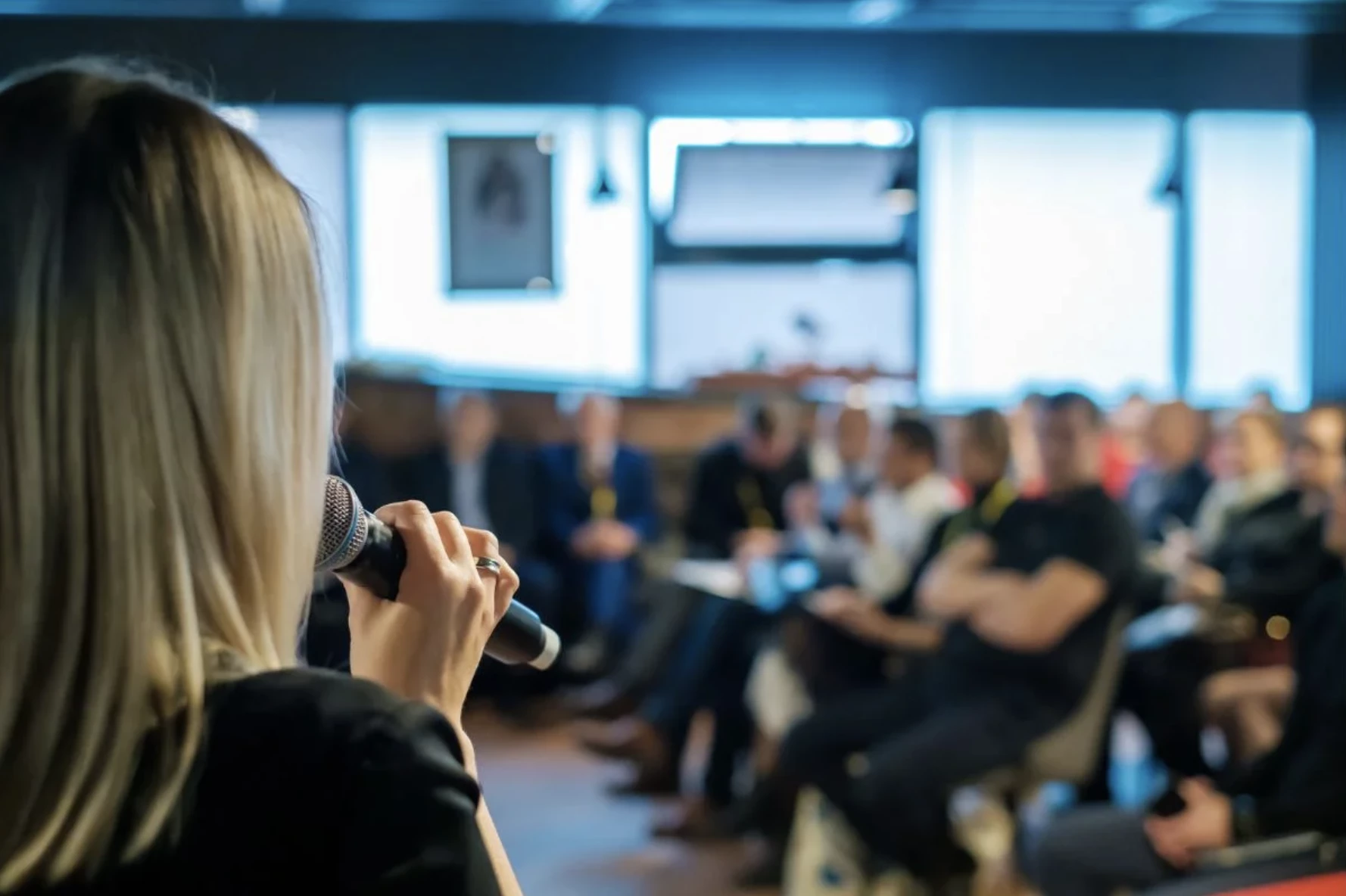 Women speaking at event