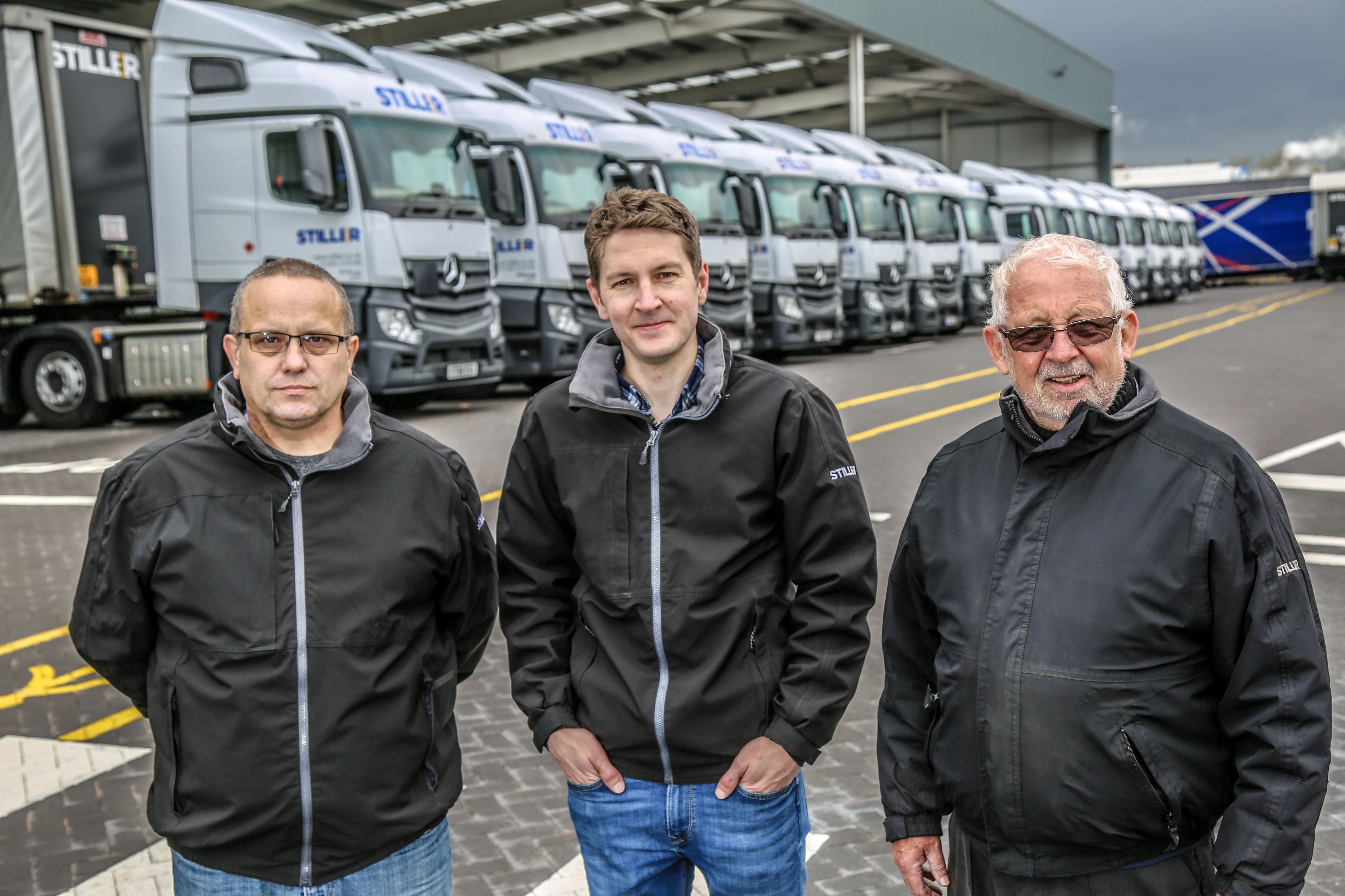 L-R: MD Matthew Stiller (centre) with (L-R) resource manager John Garrett and driver Bill Vince