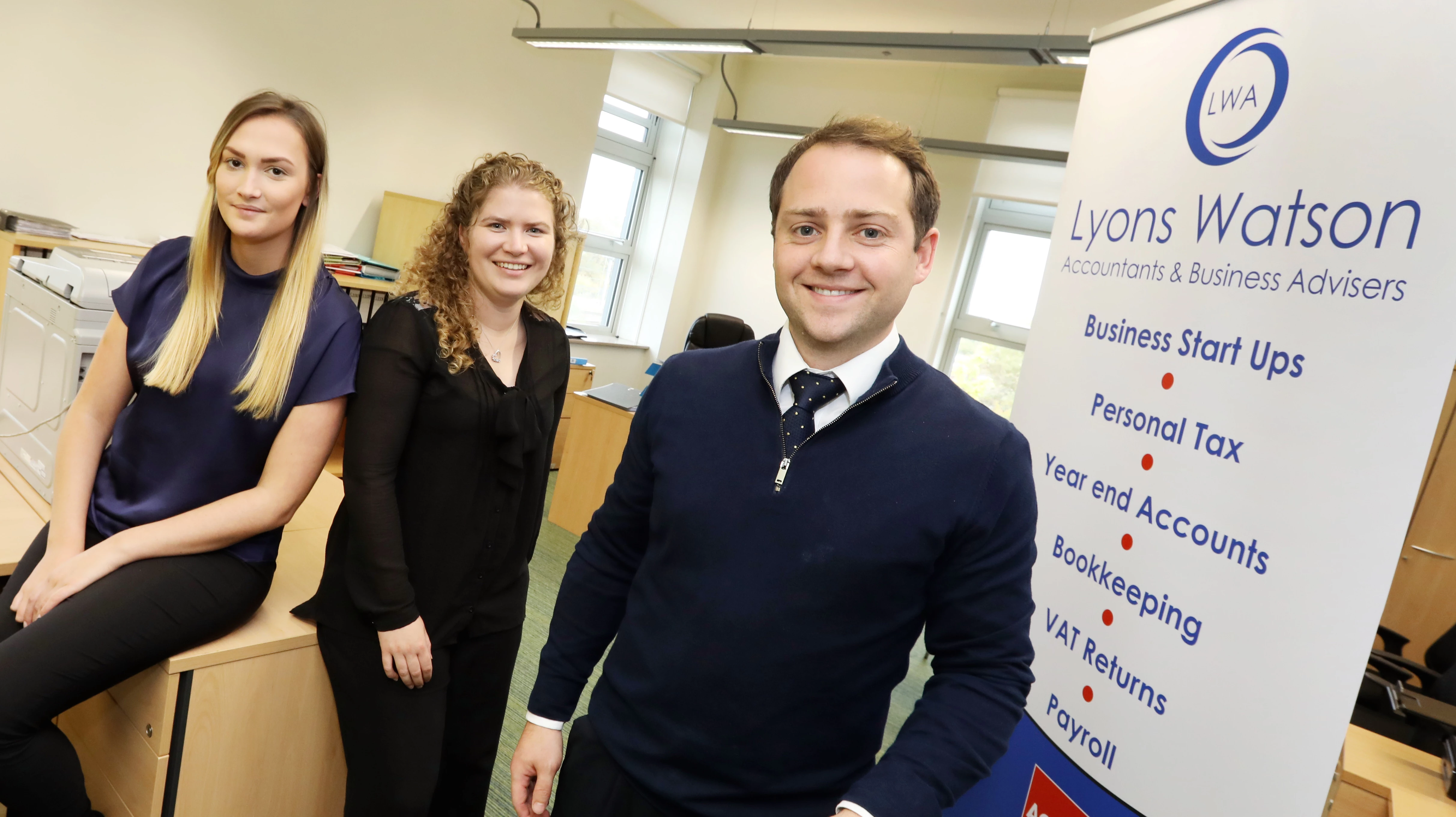 Nick Lyons (right) with his team at Business Central