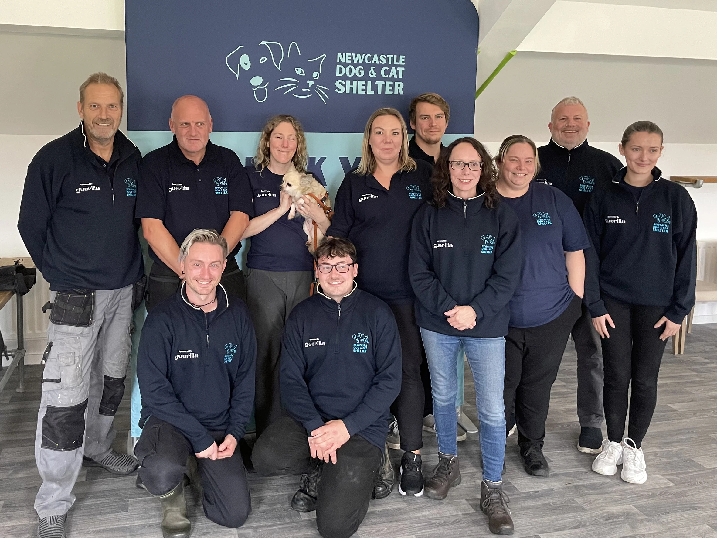 The Newcastle Dog & Cat Shelter team in their new Uniforms with James Allen, Gary Picketing from Guerilla.