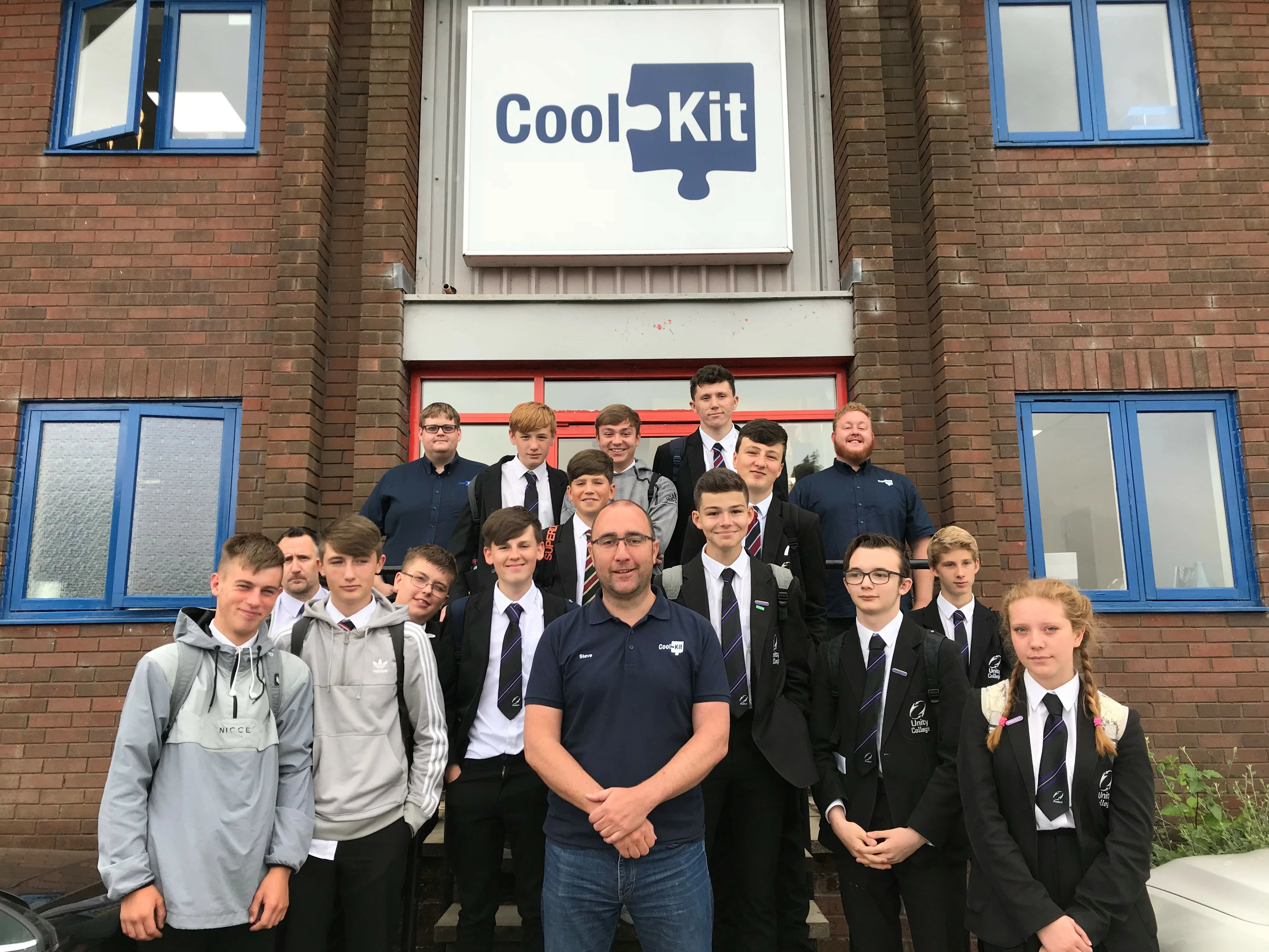 Unity College students with Steve Wilkinson (front centre), James Smith (back left) and Chris Bromley (back right) during their visit to CoolKit.