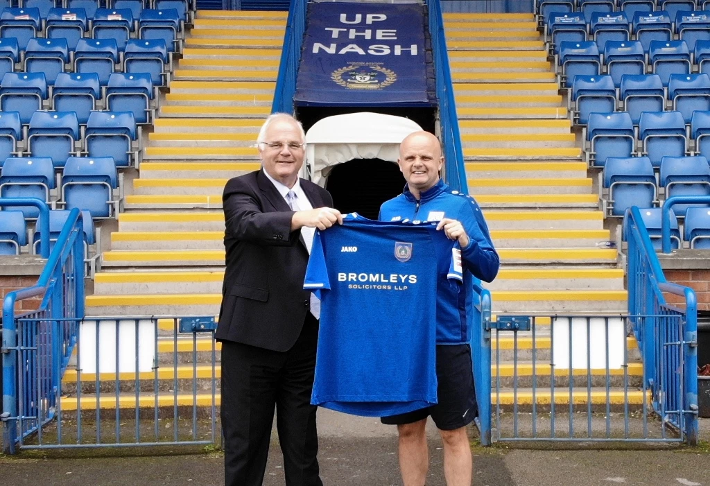 Bromleys’ senior partner Mark Hirst, left, with Curzon Ashton’s first team manager Mark Bradshaw.