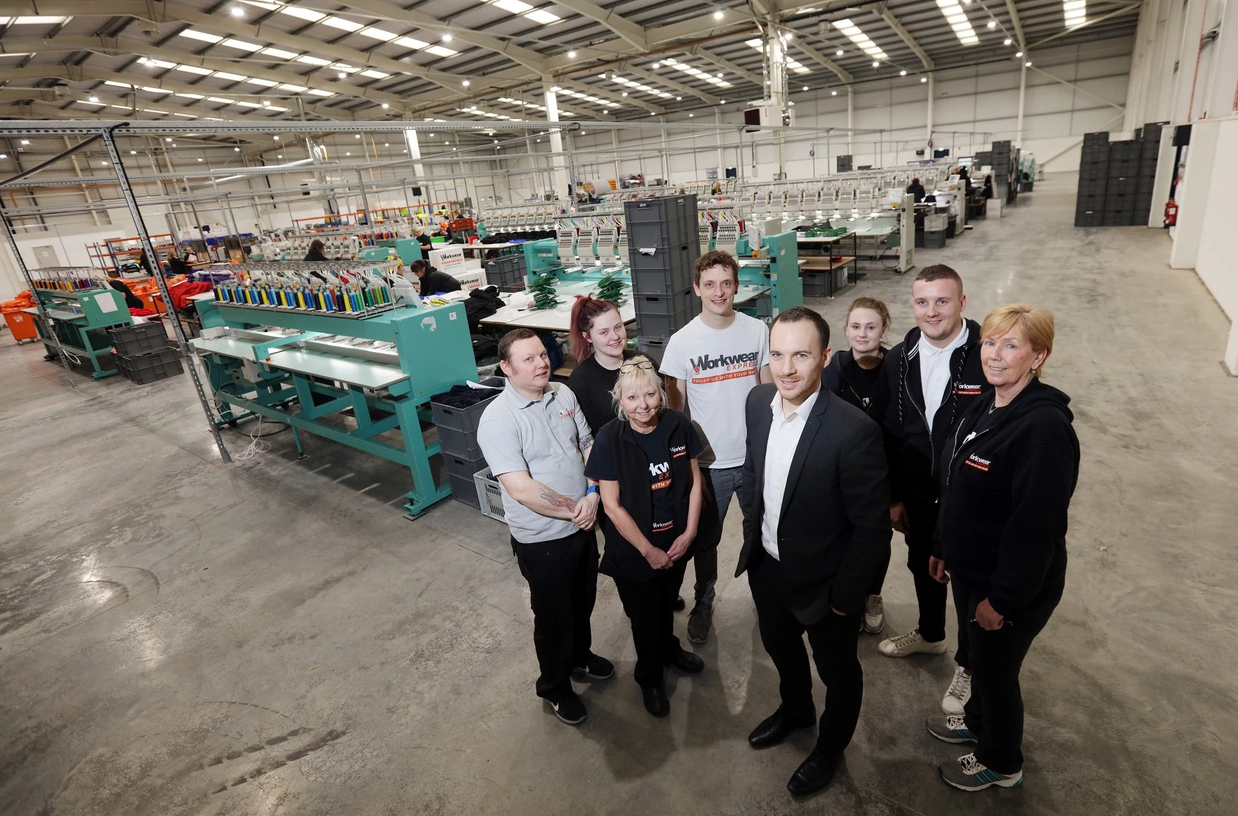 Workwear Express general manager Simon Maw with members of the team