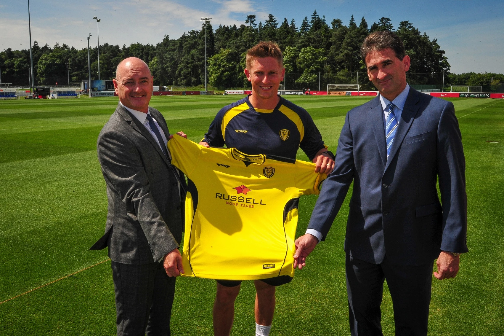 Left to right Andrew Hayward from Russell Roof Tiles, Dan Robinson from Burton Albion and Juan Prestamo CEO of Russell Roof Tiles 