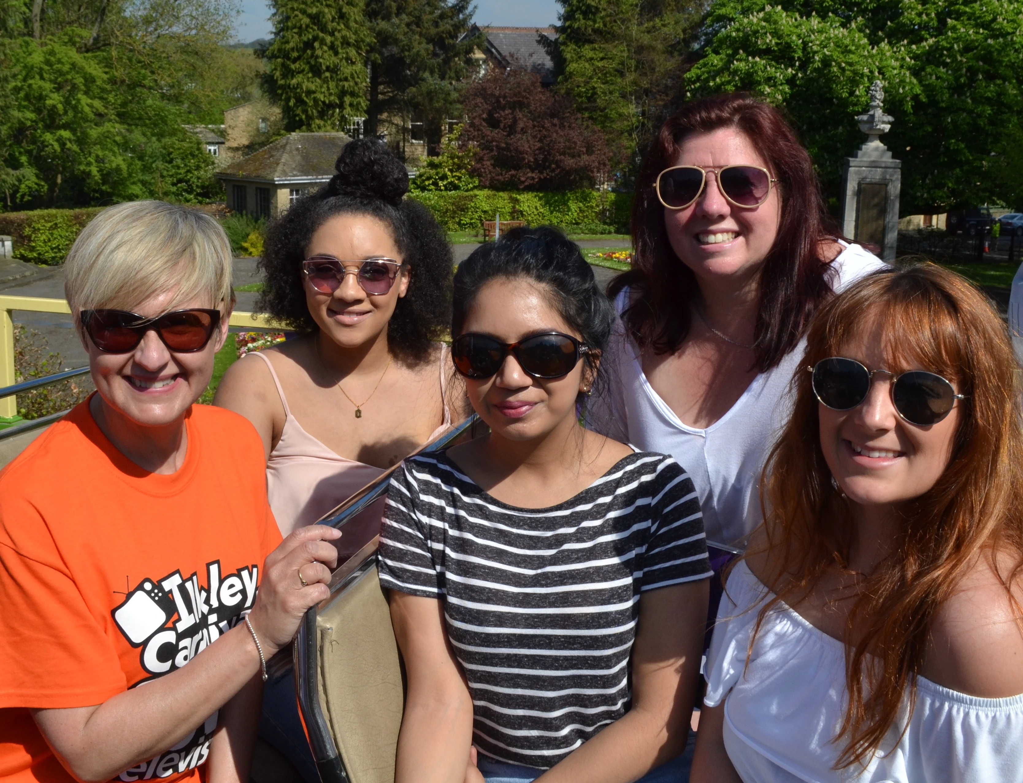 L-R ‘In the thick of it!’ MD of Approach, Suzanne Watson with team members Oriana Storey, Anisha Mistry, Helen Elson and Rebekha White on the Ilkley Carnival open top bus on Carnival Day 2018