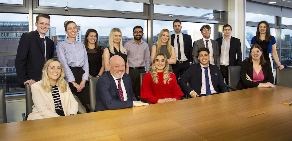 Some of KPMG’s 21 newly promoted professionals, with office senior partner, David Elliott (front row, second from left)