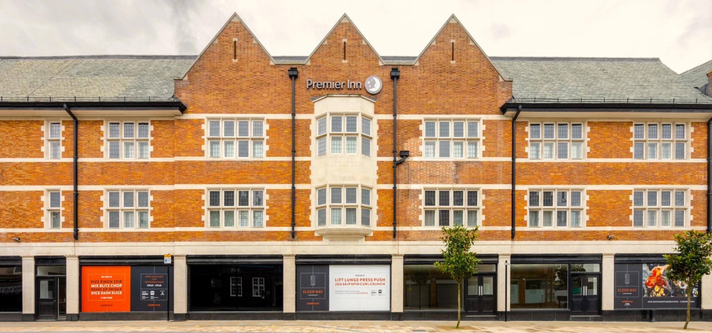 Outside of Premier Inn Elder Way Chesterfield Town Centre with available retail units below