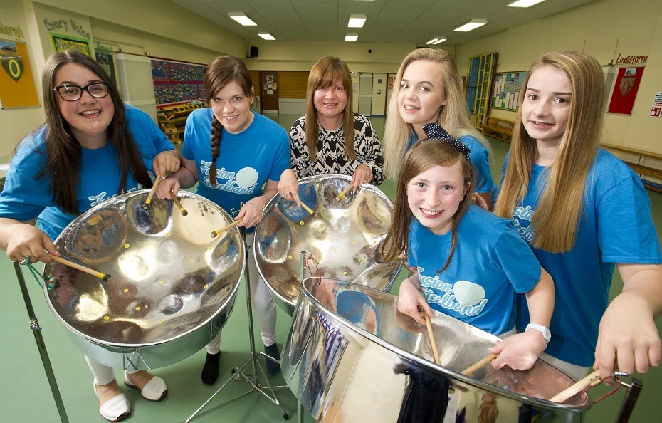 Fusion PR’s Joanne Hunter (centre) with Fusion Steelband members Jenny Chan, Claire Falcus, Caitlin Lockey, Sophie Purvis and Josephine McCabe.