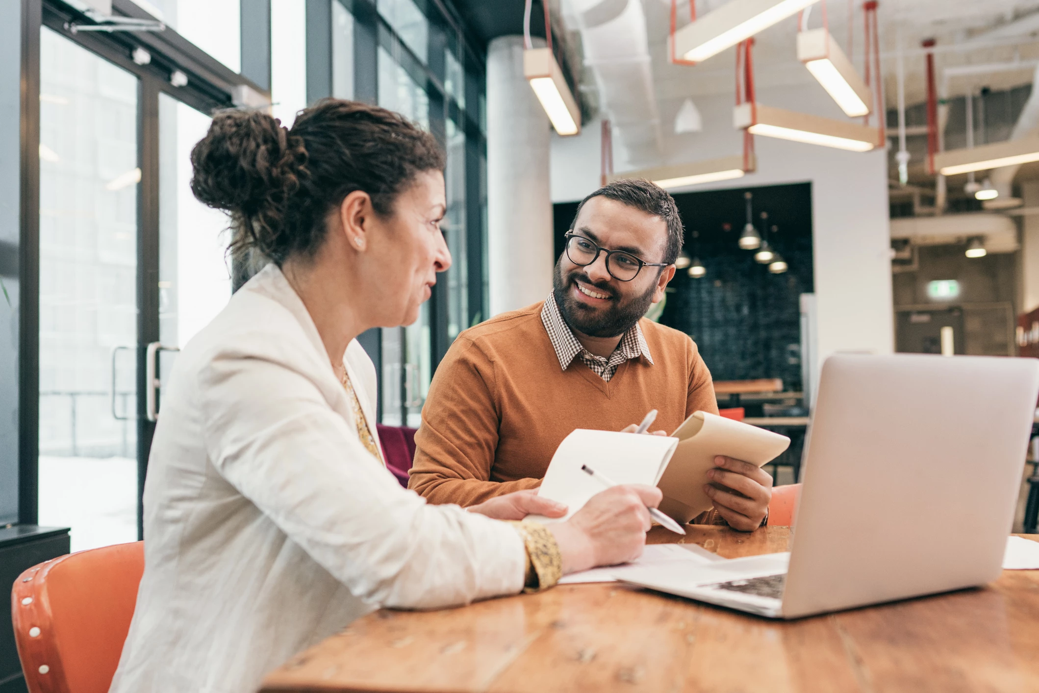 People in the office discussing business strategy