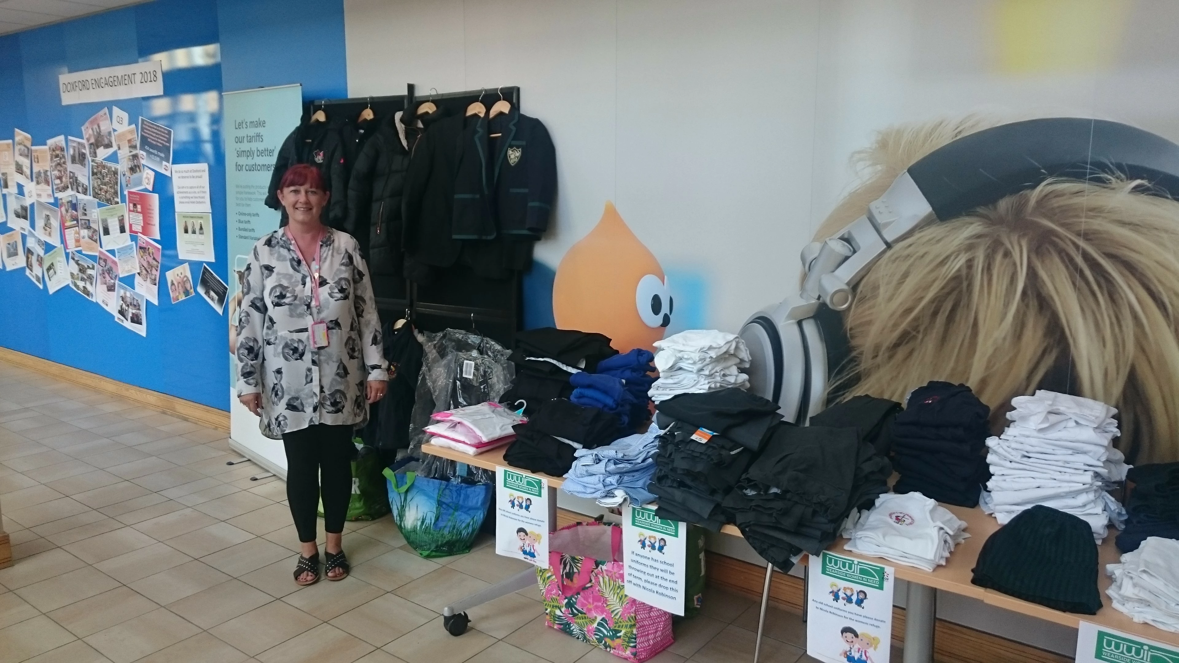 EDF Energy team manager Nicola Robinson with the collection of uniforms.