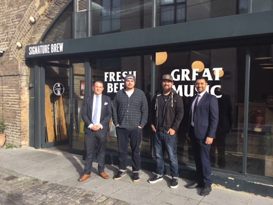 Tom Bott and Sam McGregor of Signature Brew (centre L-R) with NatWest's Daniel Copsey and Manveer Degun