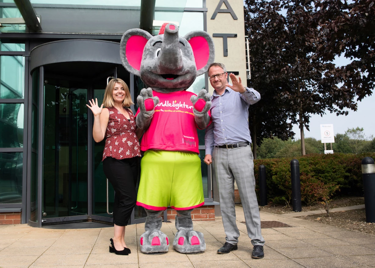 Land Director, David Coe with Amy Harrison and the Candlelighters mascot