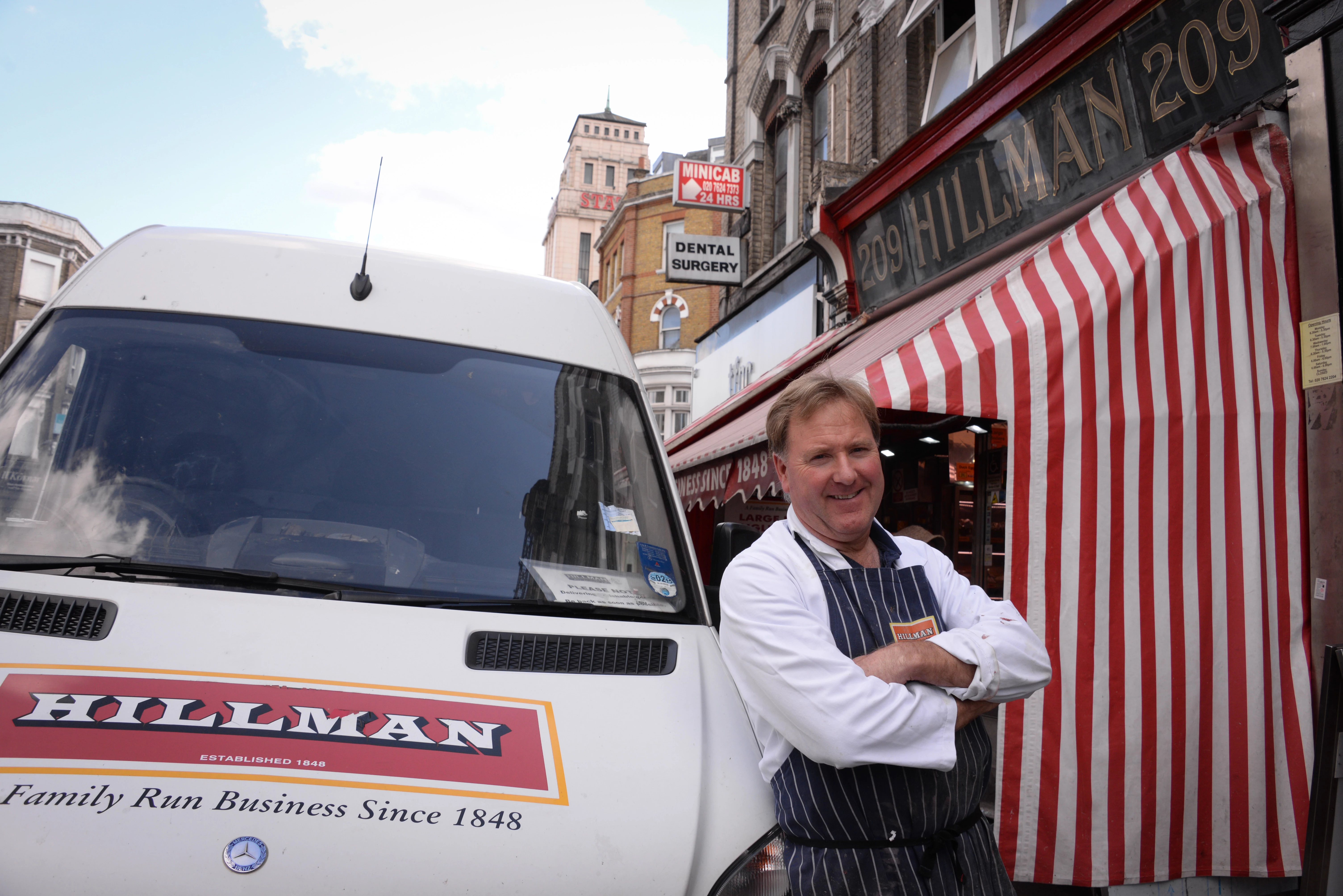 John Hillman outside his Kilburn shop