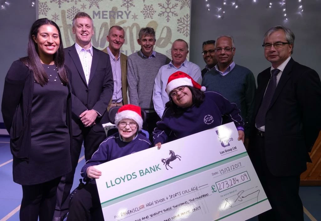 Pictured are: Jasmin Douglas, Darren Marr, Danny Sawrij, all Leo Group; Martin Moorman, Ravenscliffe School headteacher; John Brooksbank, AWM; Manjit Singh, Leo Group; Ian Archibald, Mazars, Mohammed Fayaz Ahmed from Iqbal Poultry, and two pupils