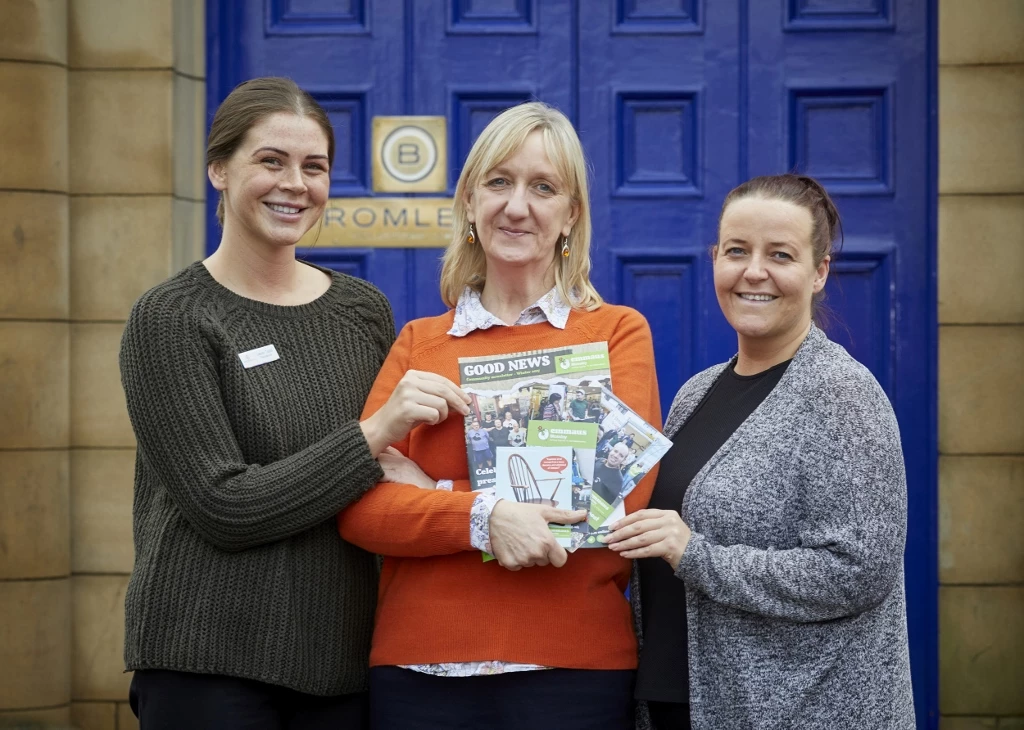 Bromleys’ charity committee members Lauren Taylor, left, and Jill Lomas, right, with Gillian Nettleton of Emmaus Mossley.