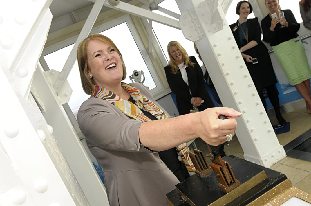 Principal Bev Robinson pulls the world-famous Blackpool Illuminations switch to light up the Tower in B&FC colours