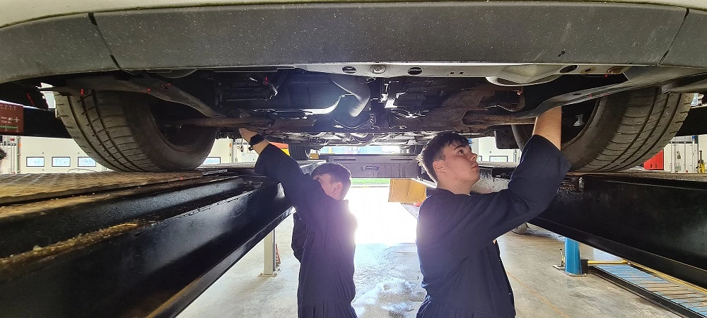 Students from Northumberland College working on the car donated by Sherwoods