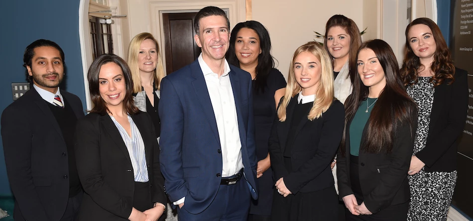 Adam Kerr (centre) with members of Primas Law's Cheshire team