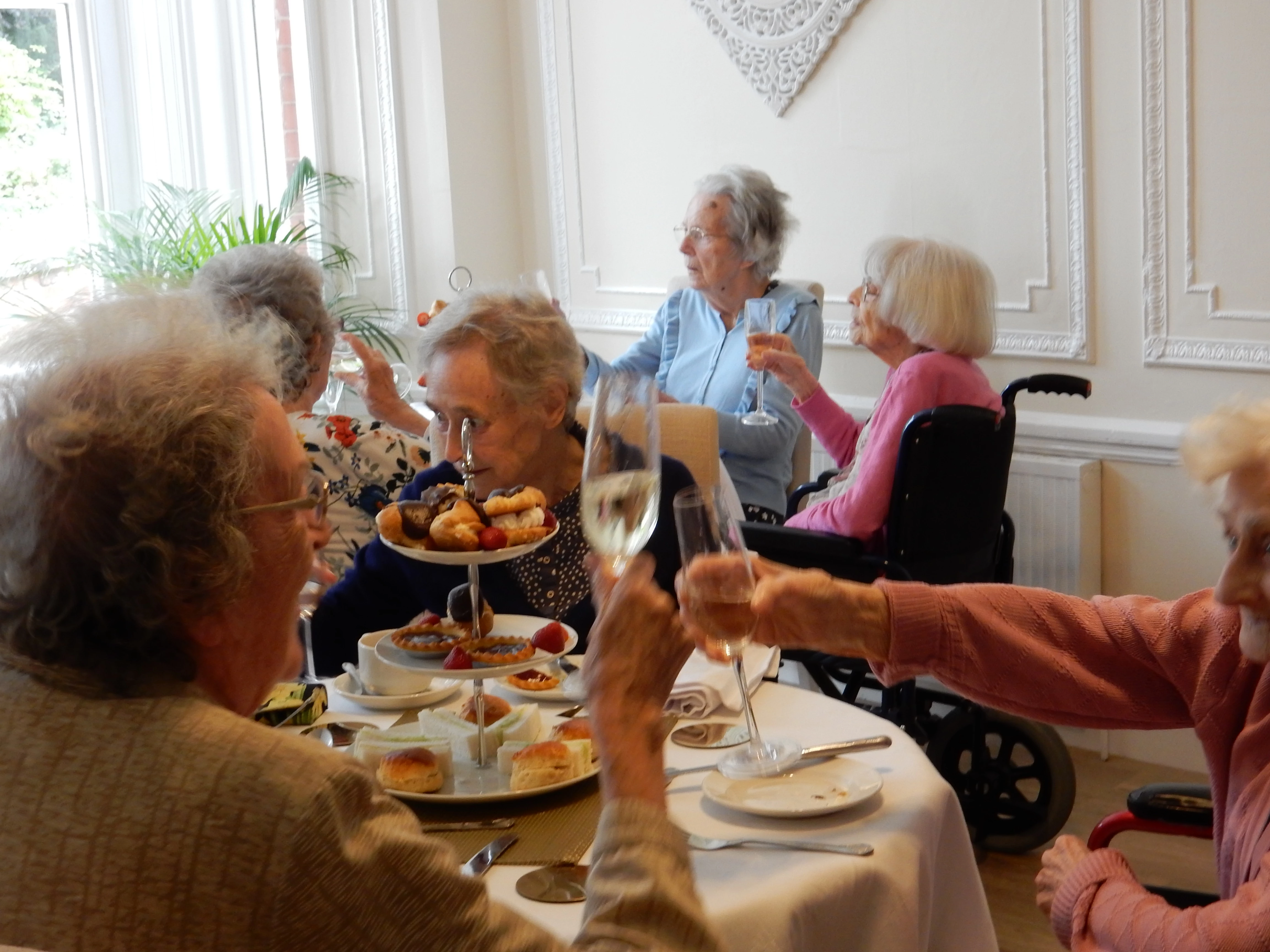 Pictured are residents celebrating in style in the newly refurbished residents dining room at Propsect House care home.