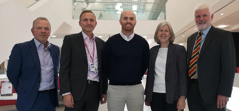 Beacon of Light General Manager Phil King (centre) flanked by the NHS Delegation including Karen Turner, the Prevention Director NHS England and NHS Improvement 