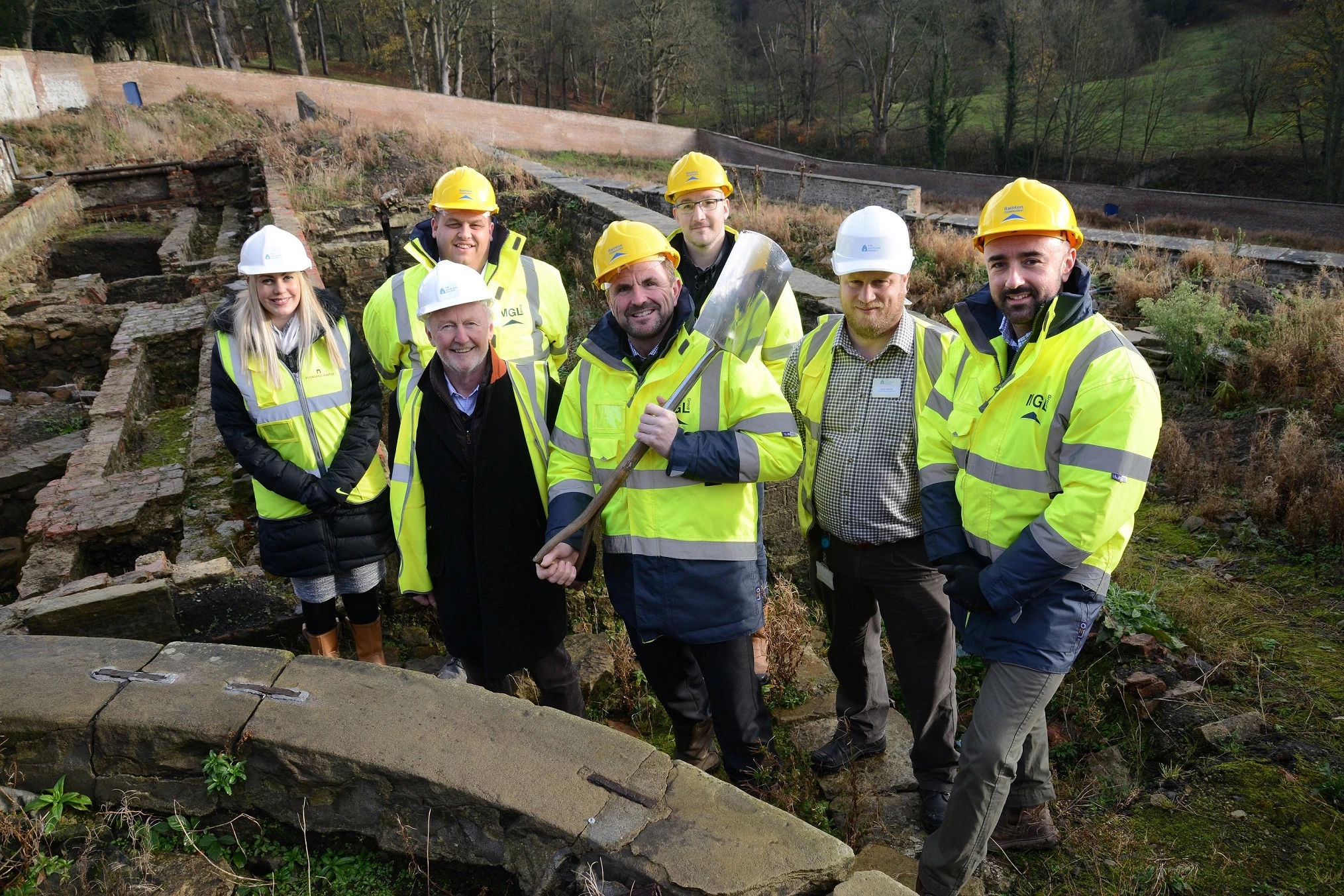 Representatives of The Auckland Project and Rainton Construction at the Walled Garden at Auckland Castle. 