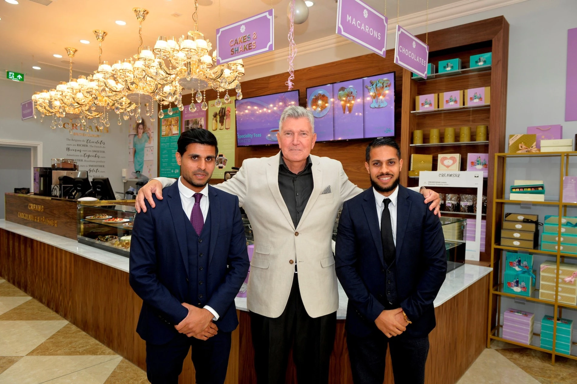 Teyeb and Unzar Aleem with former Cash Converters CEO, Mark Lemmon.