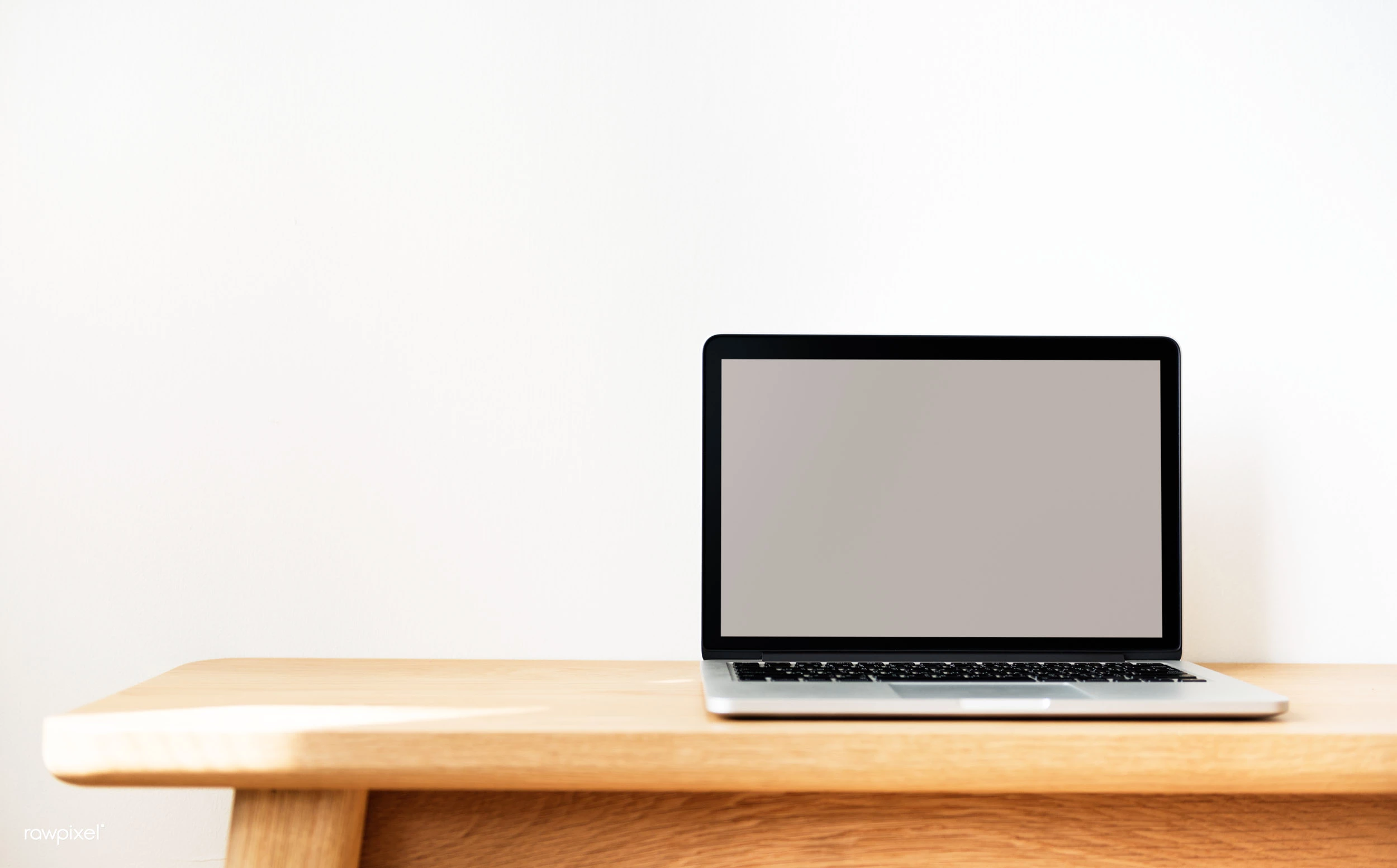 Laptop on a wooden table