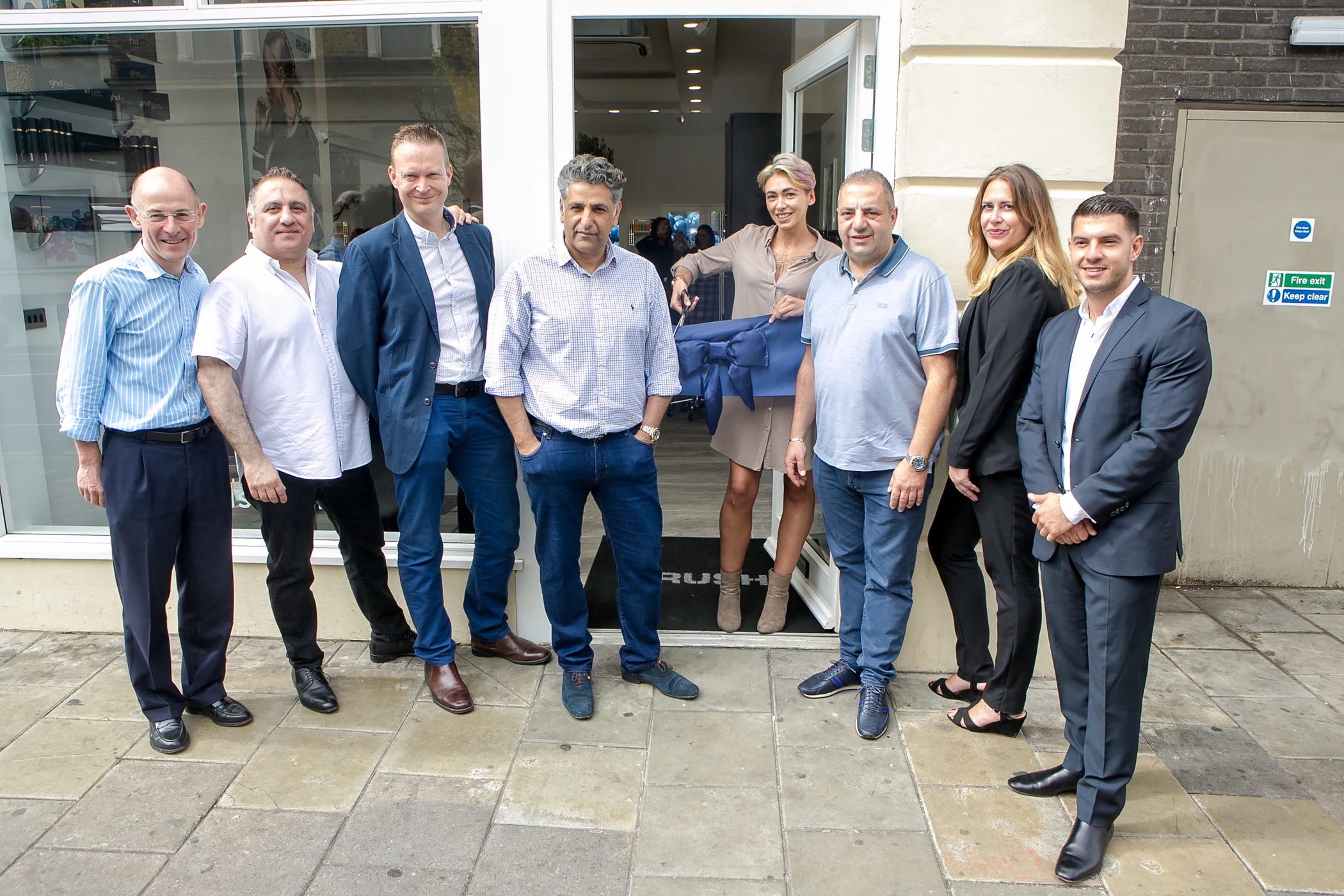 From L-R: Chris Rogers, Chairman, George Phouli, Operations Director, Ed Grimes, COO, Co-Founders  Stell Andrew and Andy Phouli, Julie Dorres, Operations Manager and Peter Phouli, Vice Chairman  