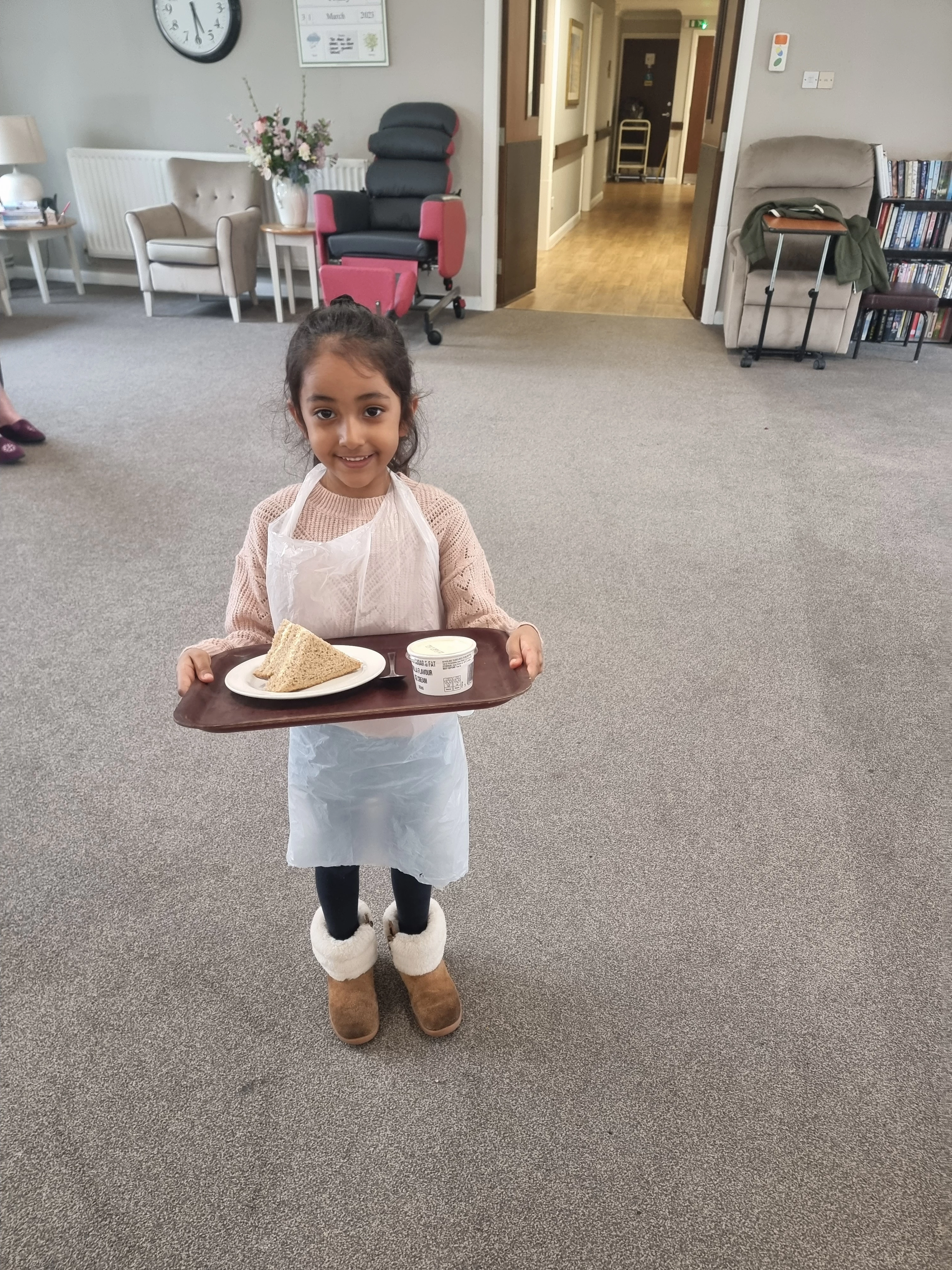 Young Aariya taking a volunteering role helping everyone at Wombwell Hall Care Home