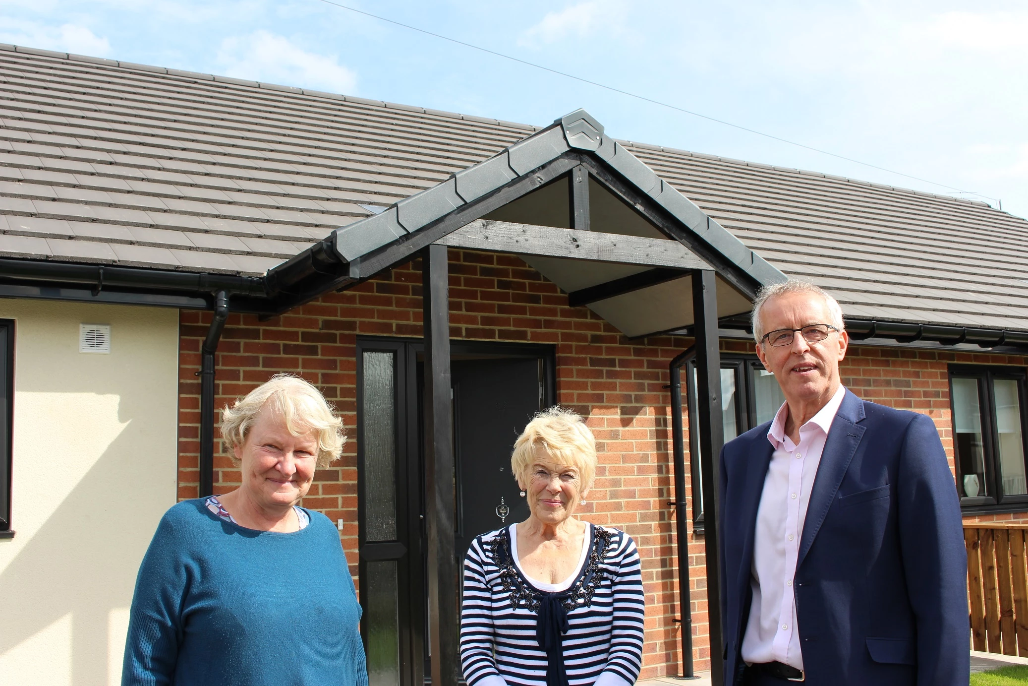 Helen Goodman MP, tenant Mrs Brown and County Durham Housing Group Chief Executive, Bill Fullen.