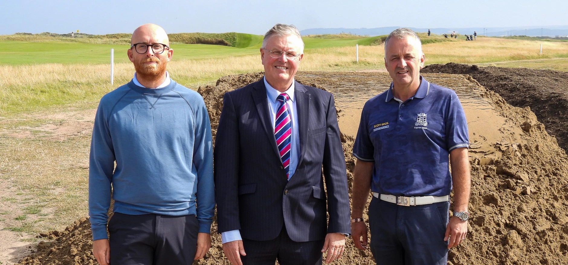 L-R: Club manager Alex Shaw with Scott Bros directors Bob Borthwick and Peter Scott following the latest delivery of the firm’s sustainably produced sand 