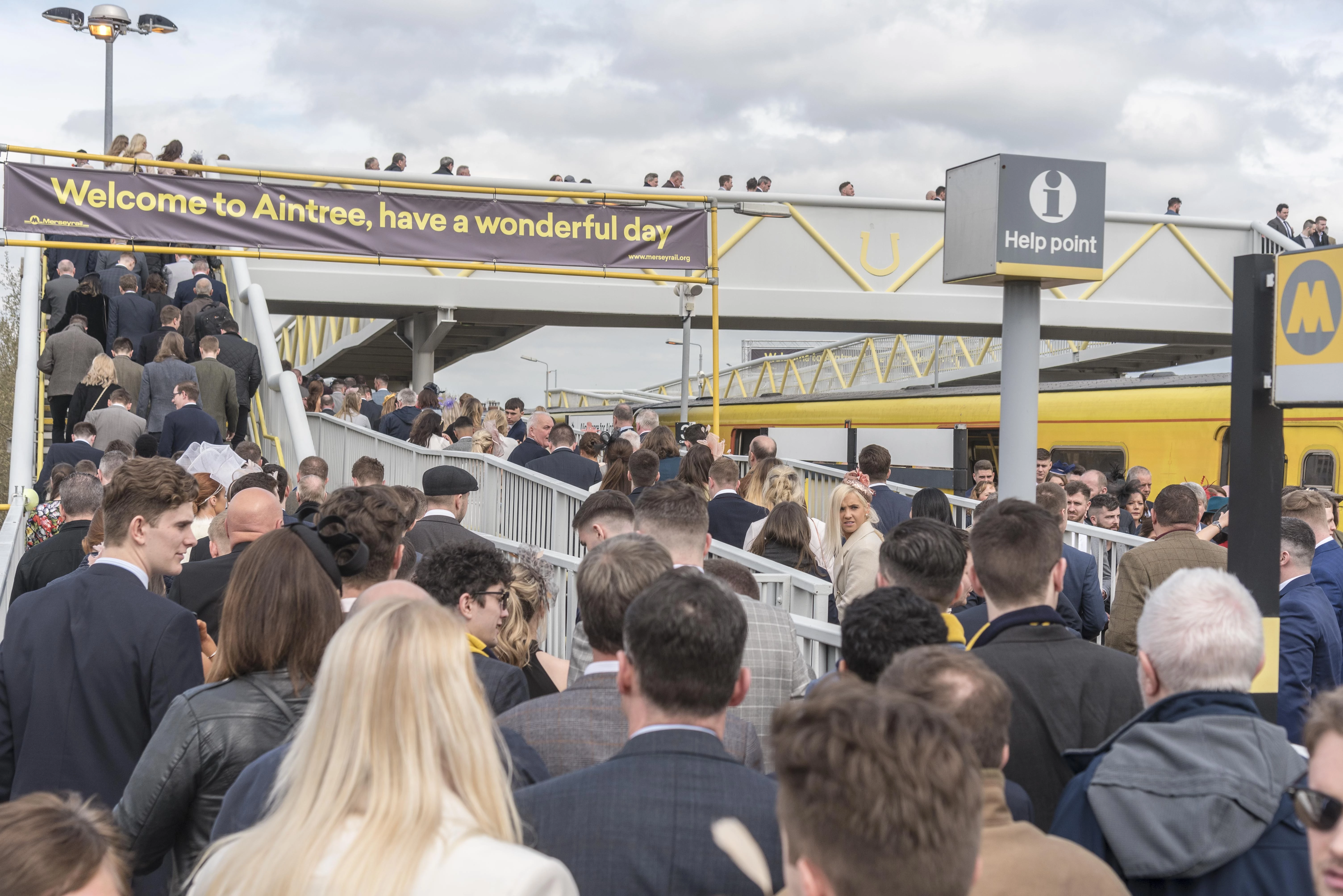 Racegoers arriving at Aintree station