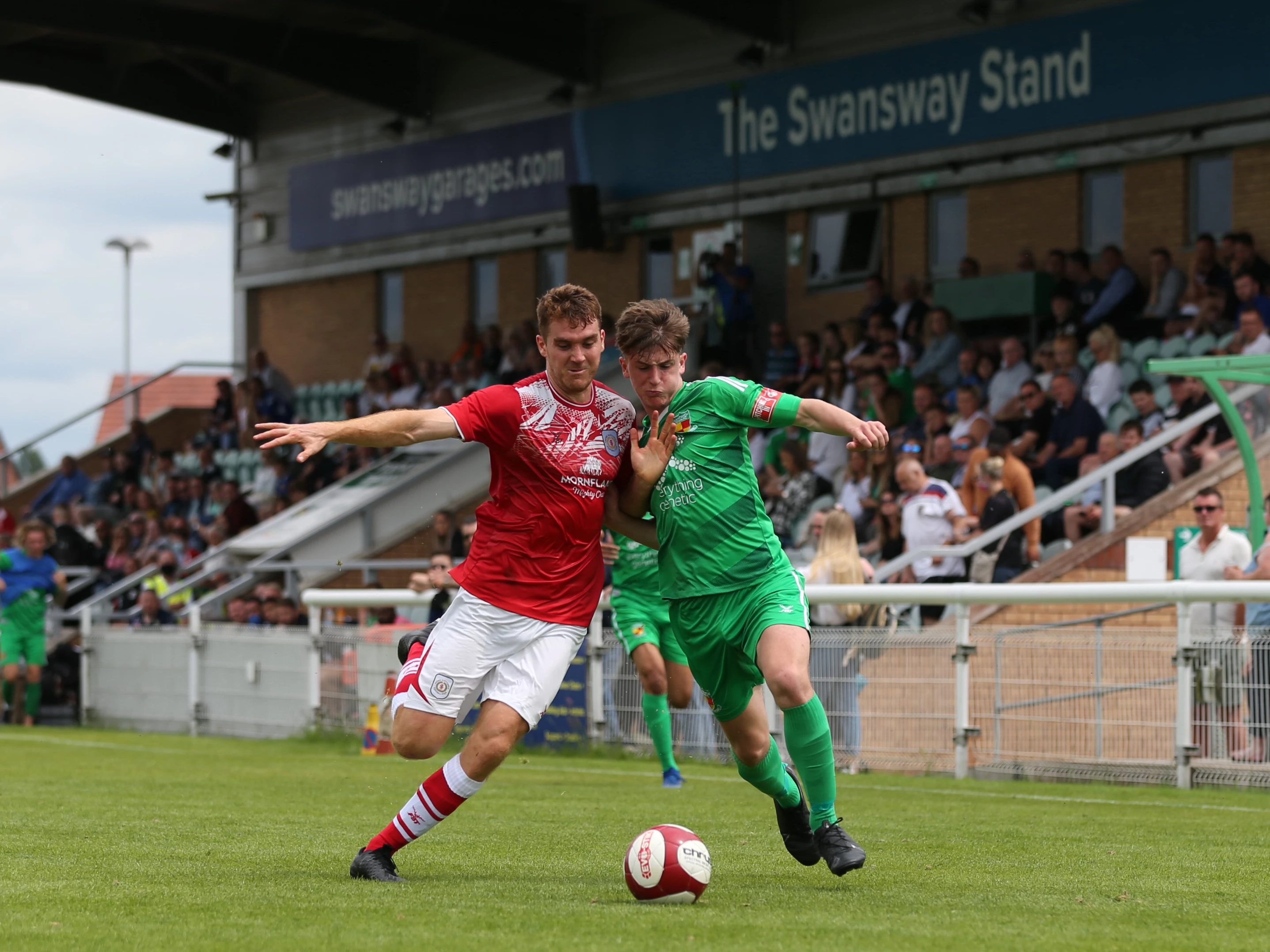 Nantwich Town FC in front of the new "Swansway Stand"