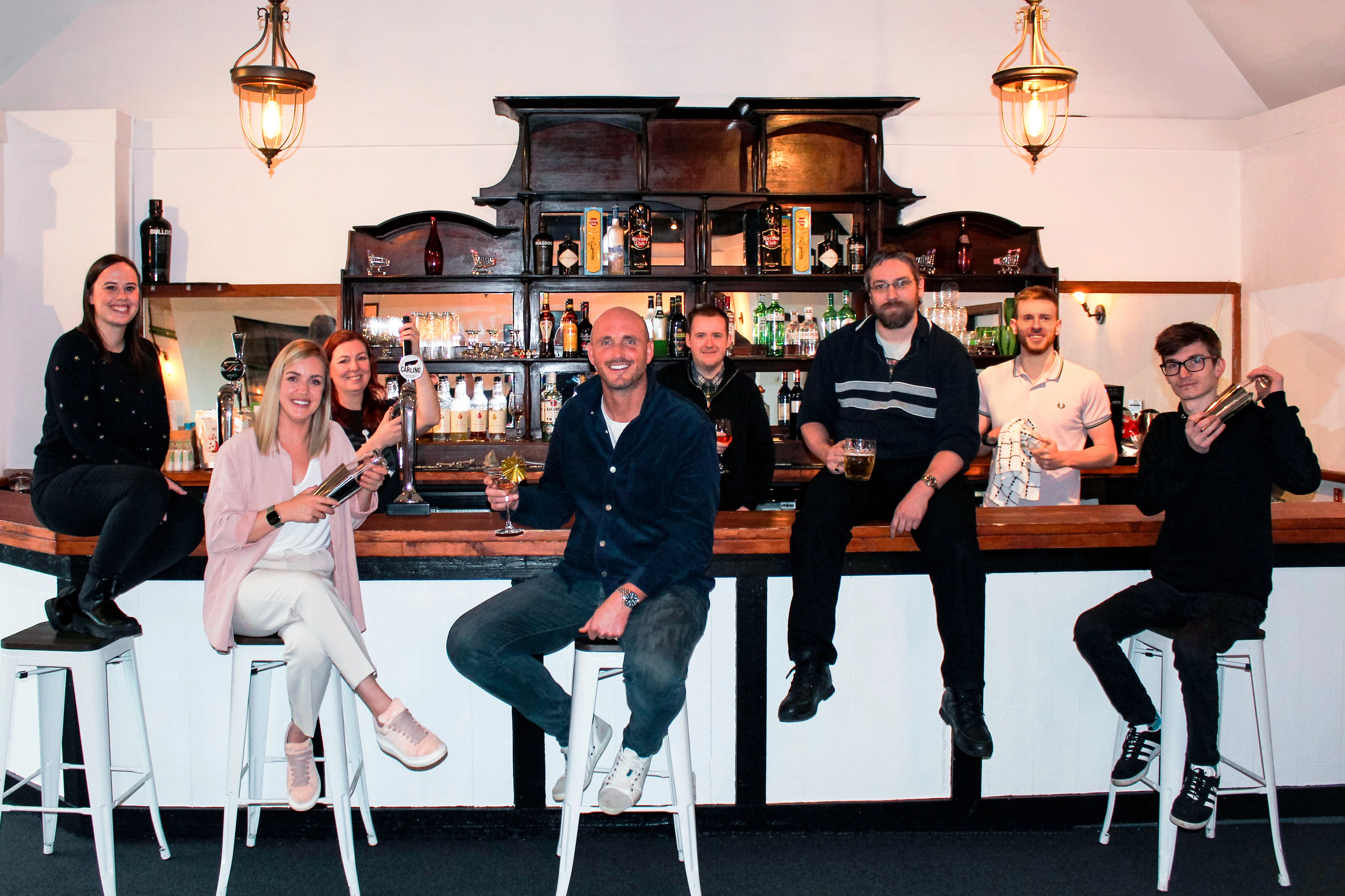 The White Digital team celebrating a year of success in their bar