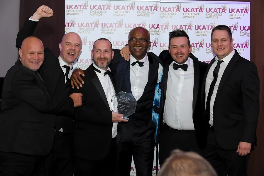 The MCP  Environmental team celebrate their award win with Olympic sporting legend Kriss Akabusi at the 2018 UKATA Excellence Awards