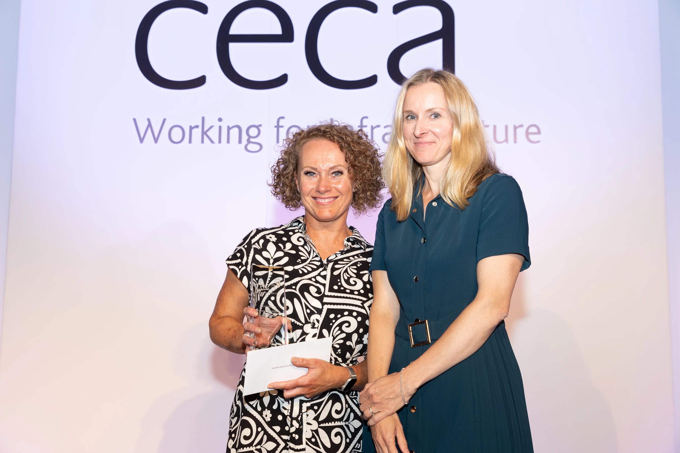 Rebecca Glendinning (left) receiving her award from CECA Southern Chair, Samantha Barratt