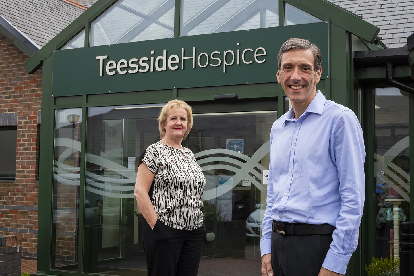 Christine Nolan, Erimus Insurance Brokers company secretary with Teesside Hospice Chief Executive, David Smith 