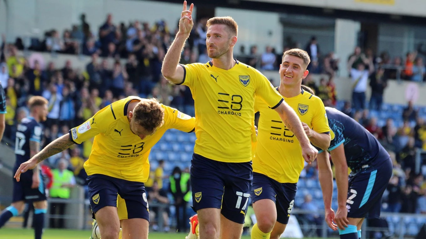 Oxford United Football Club players celebrate a goal.