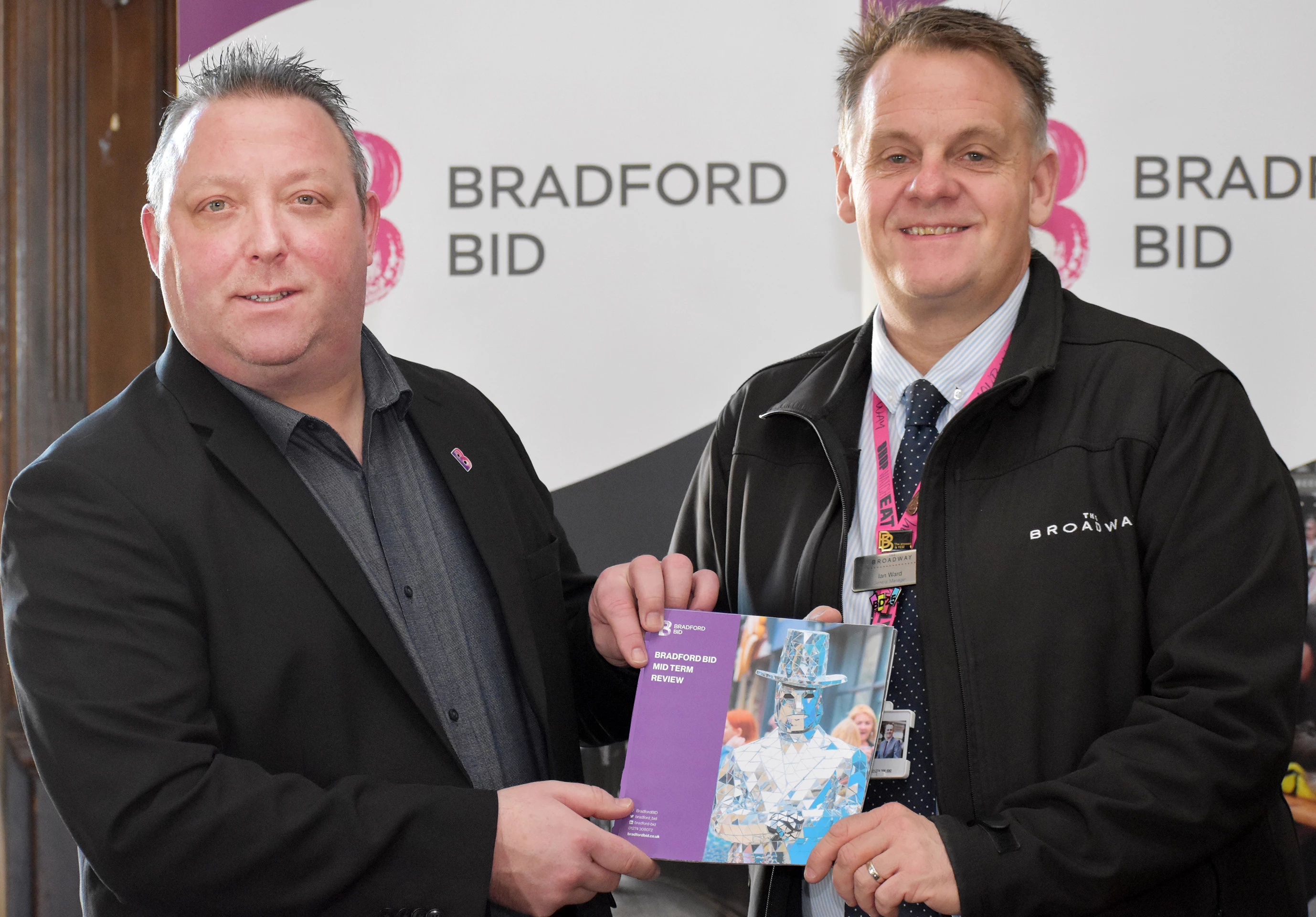 Bradford BID manager Jonny Noble (left) and chairman Ian Ward with the independent Mid-Term Report 