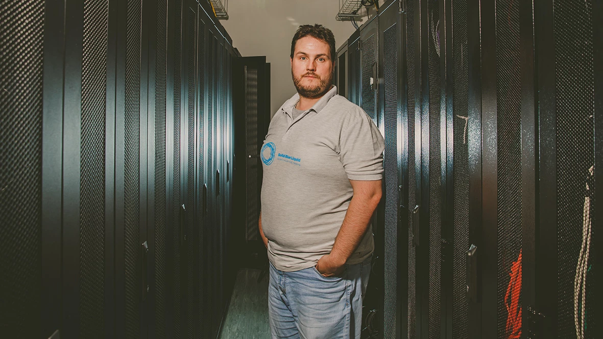 Nathan Platt, founder of Solid Blue Liquid, working in the datacentre