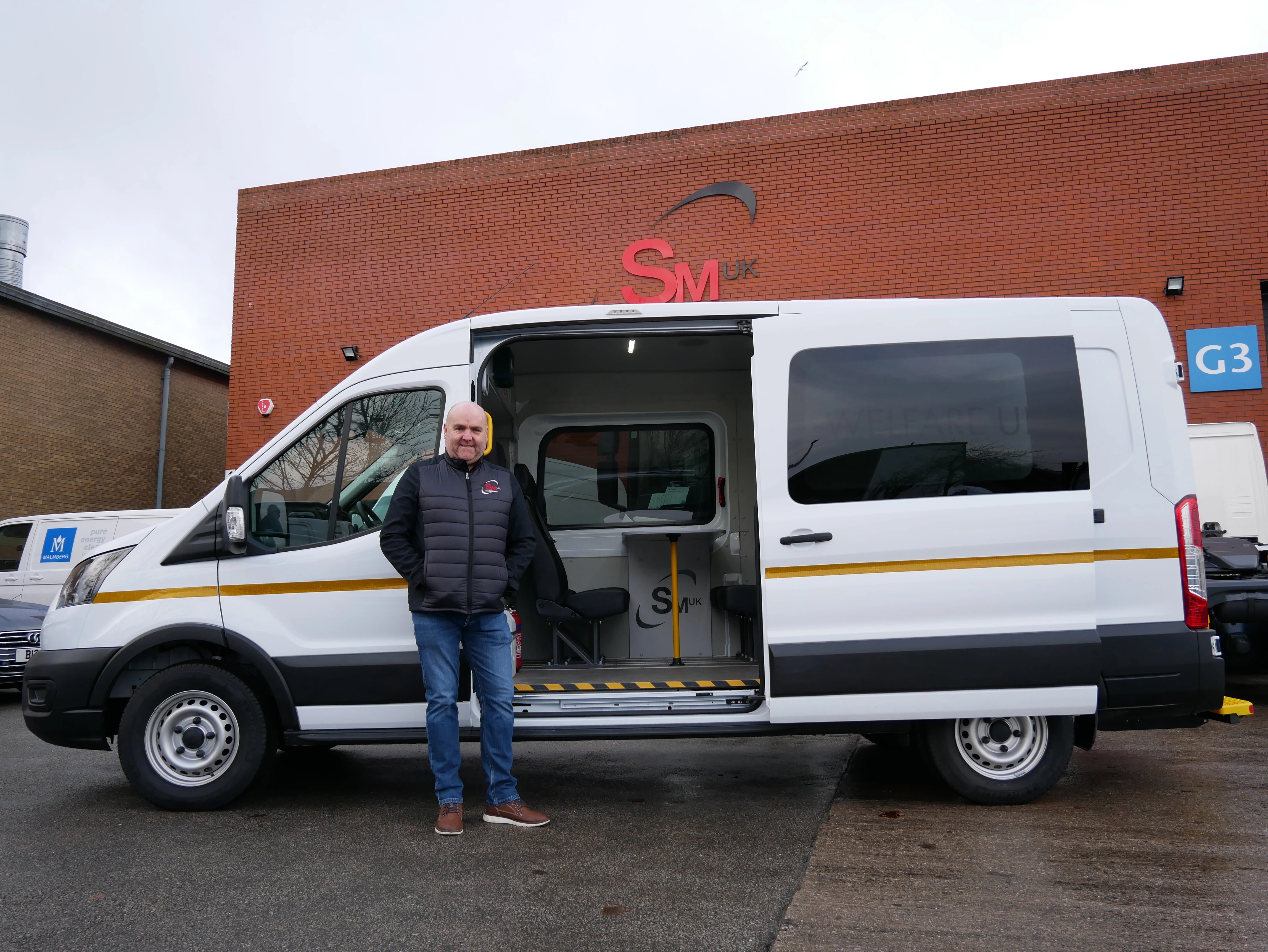 SM UK managing director Steve MacDonald with a welfare van