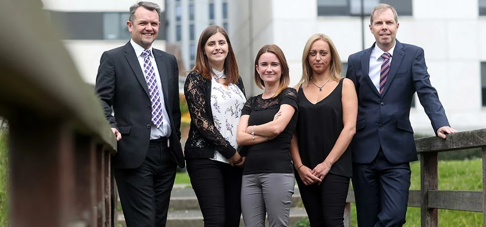 UNW Employment Taxes partner Lee Muter (left) with Payroll Manager Stuart Hogg (right) with members of the payroll team 