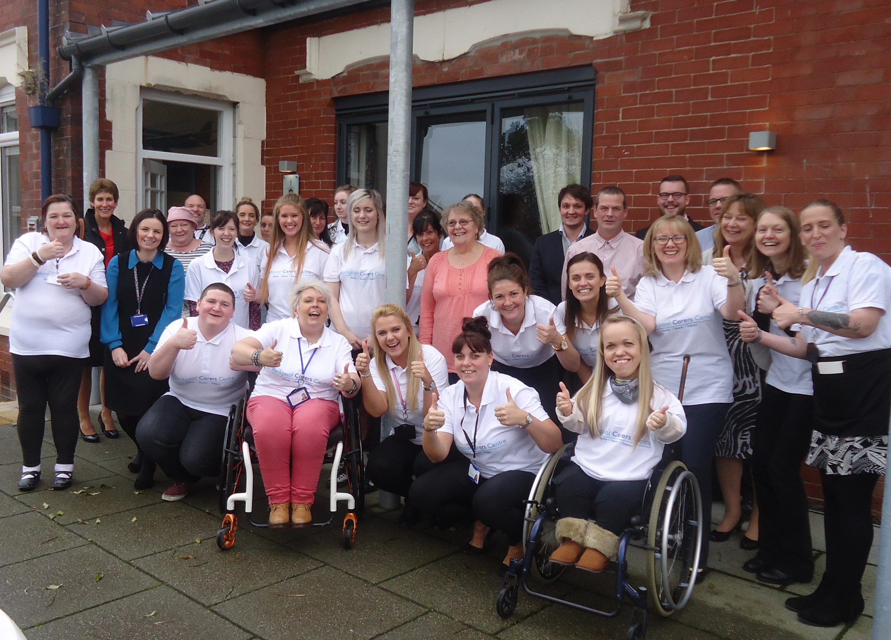 Blackpool Carers Centre team -staff, trustees, volunteers & more on 1st anniversary of DIY SOS Big Build