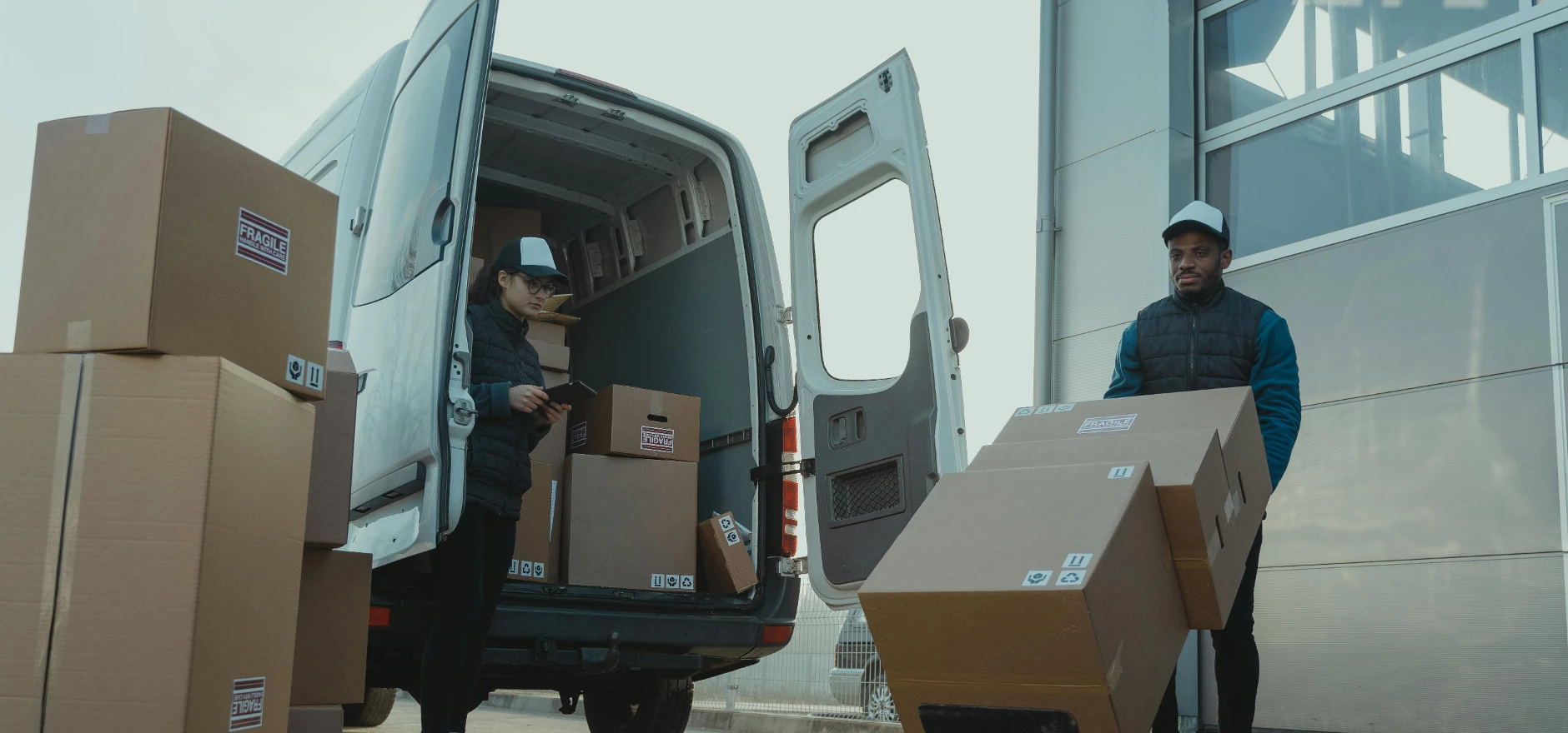 A Man and a Woman Working for a Delivery Company