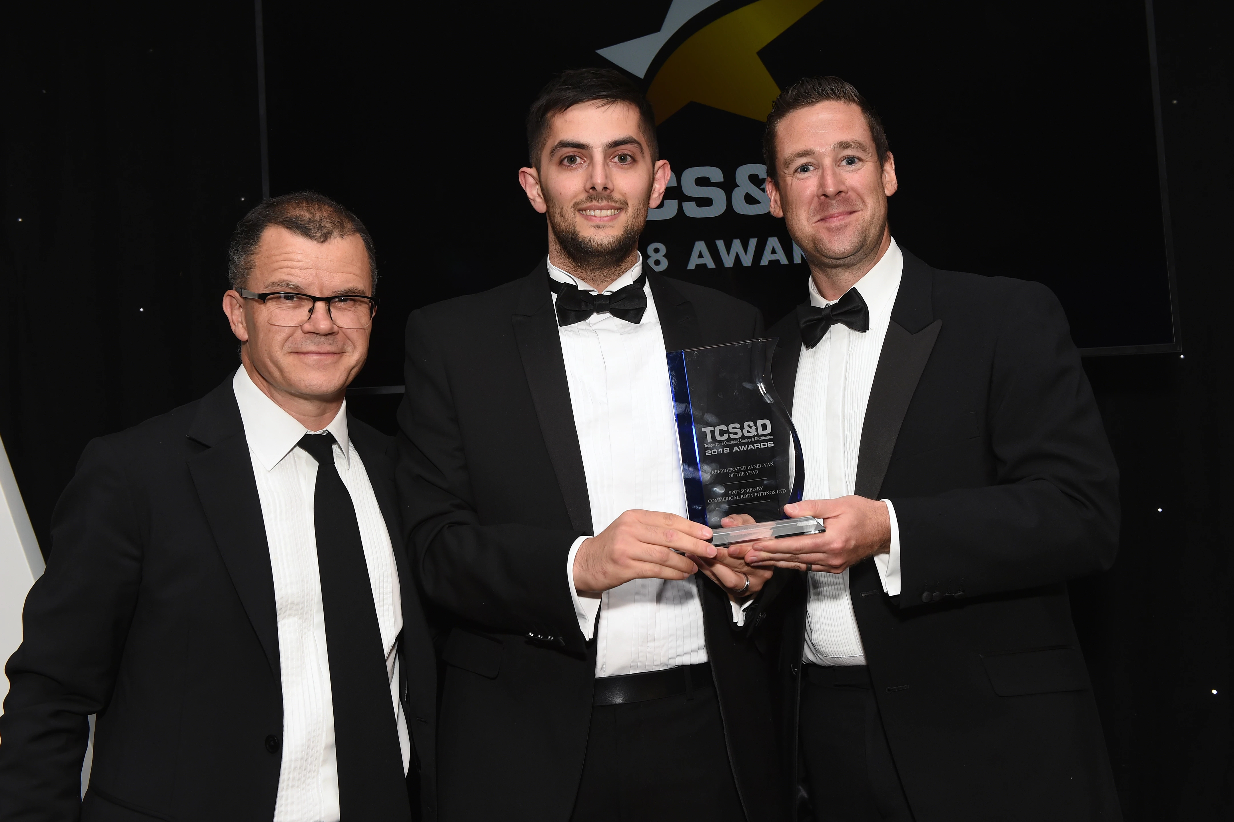 CoolKit's Cameron (centre) receiving the award